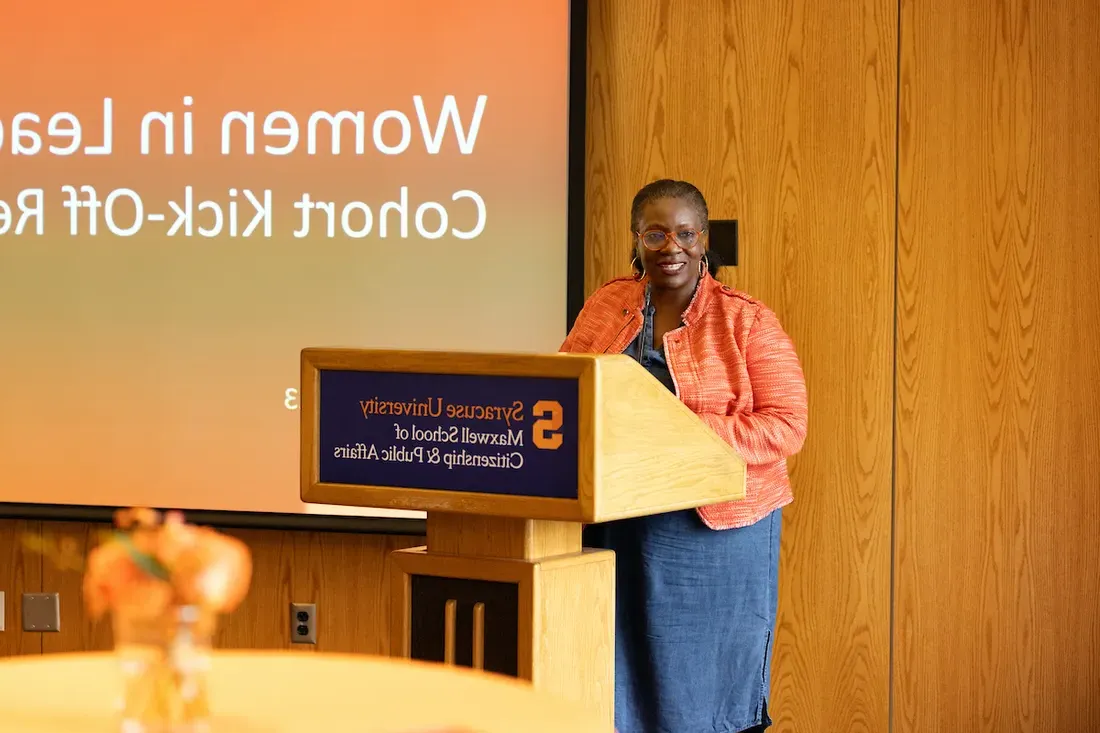 Candace Campbell Jackson stands at the lectern at a Women in Leadership Cohort Kick-Off event.